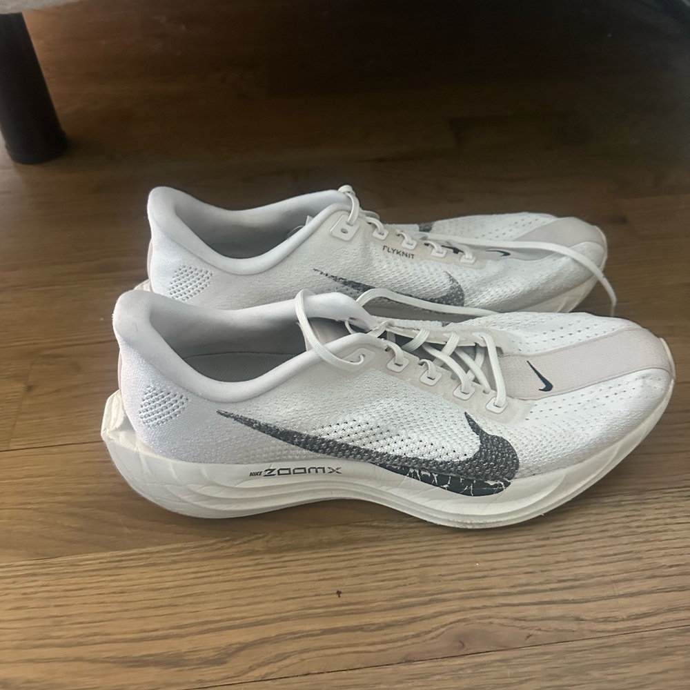 Nike White and Black Athletic Sneakers with Subtle Tan Accent